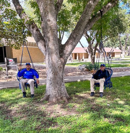 Academy cadets enjoy the swings on campus